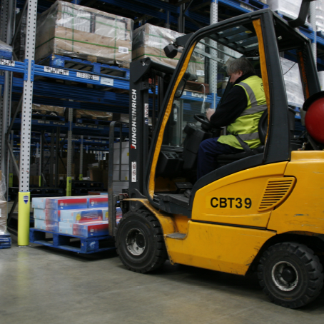 Forklift With A Pallet And Racking With Rack Armour Attached